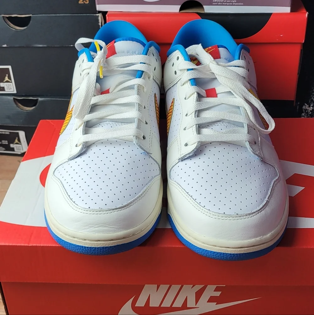 Nike White and Blue Sneakers with Orange Swoosh